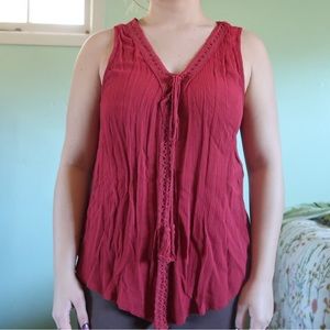 Red sleeveless blouse.